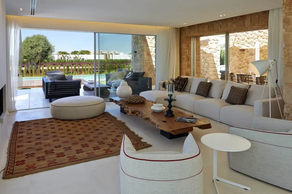 Spacious living room with large sofa and natural light