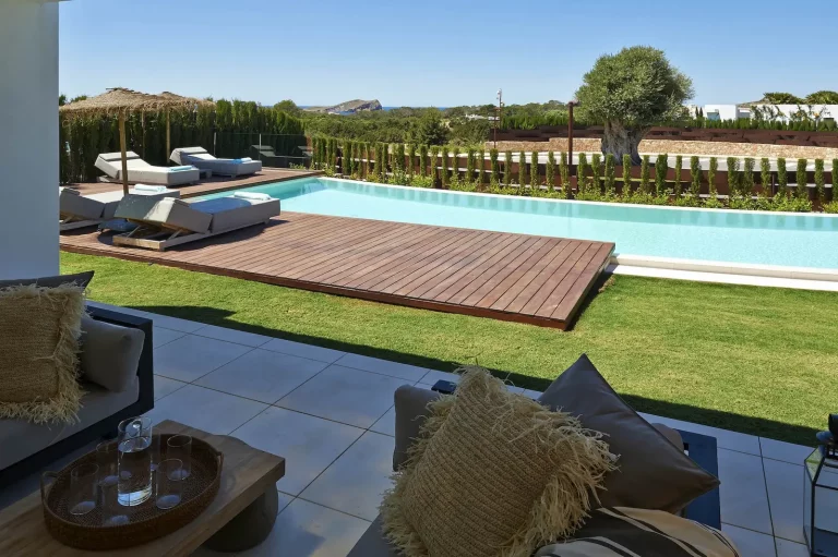 Private swimming pool with sea view towards Cala Conta coast