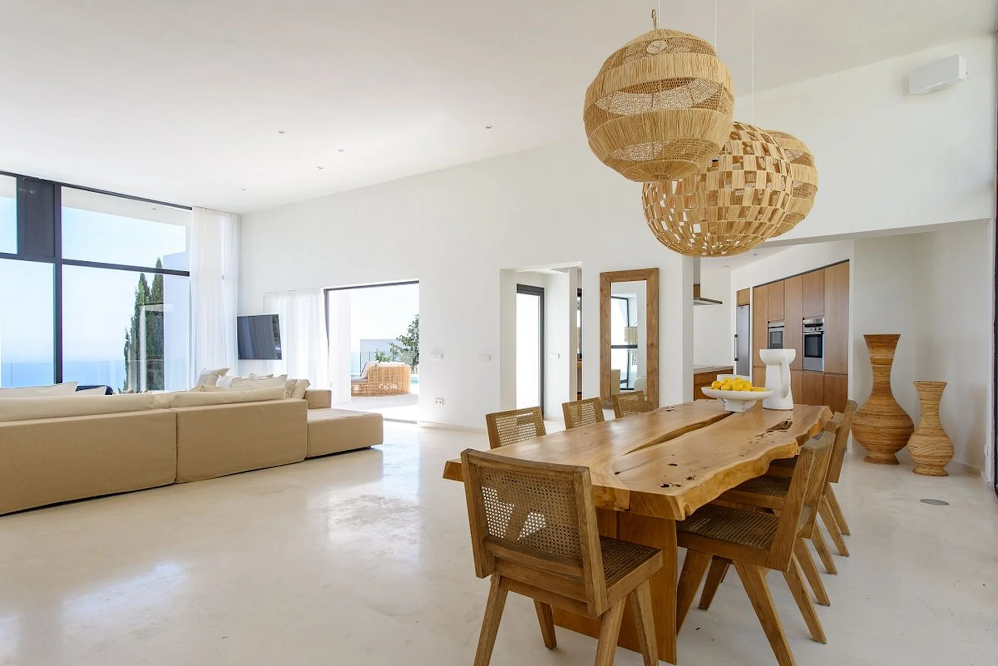 Open-plan living and dining area with natural light, Roca Llisa villa rental