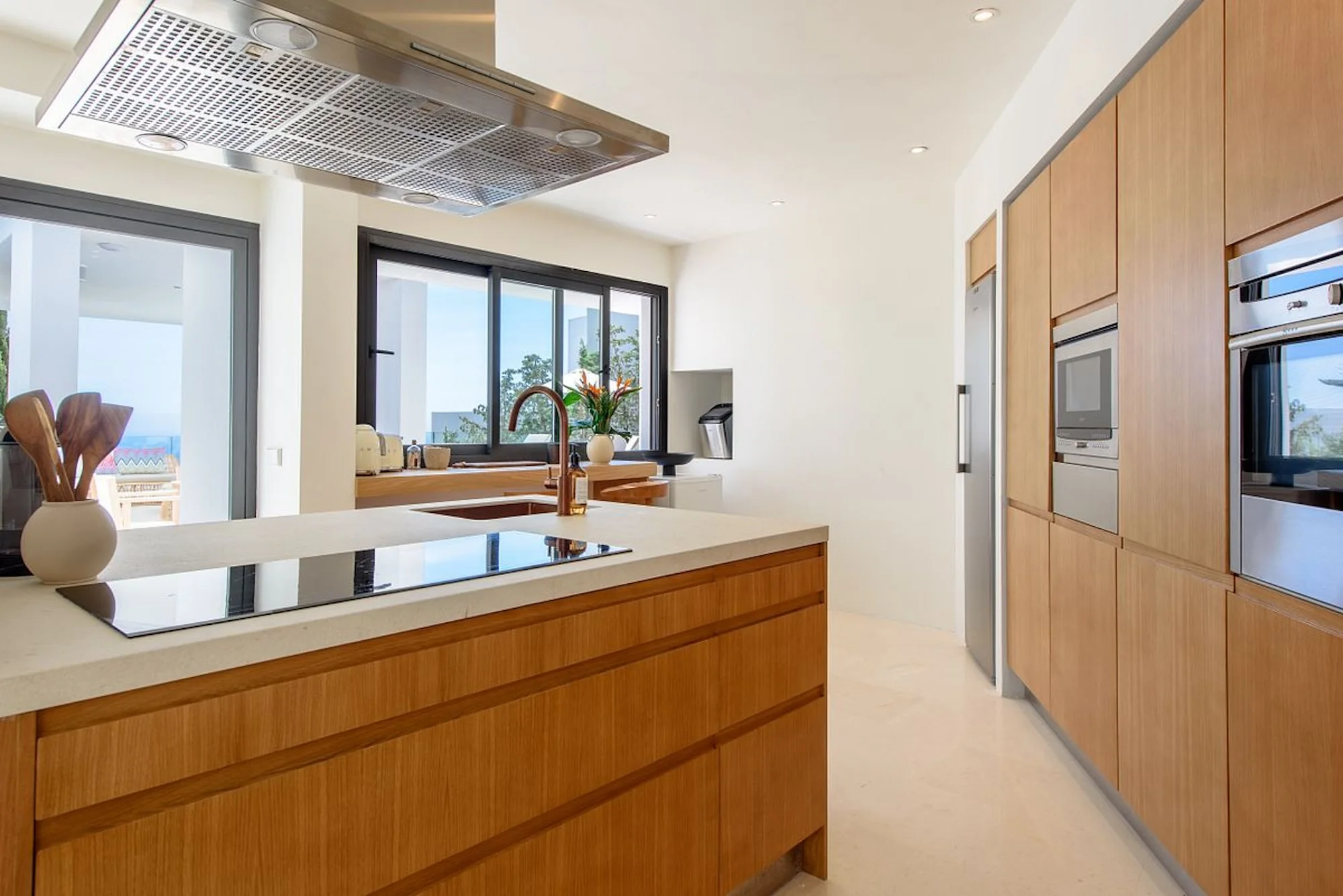 Elegant kitchen with breakfast bar, fully equipped for group stays